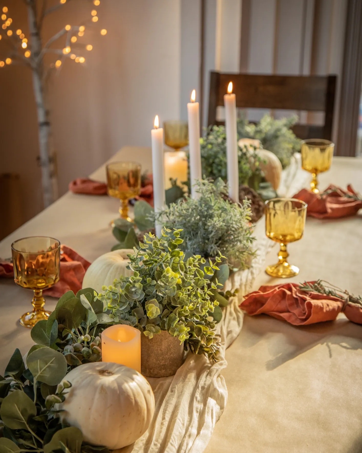 Table vignette centerpiece with candles and dried flowers